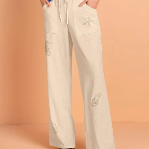 Pantalón bota ancha en tela tipo lino con estampado localizado